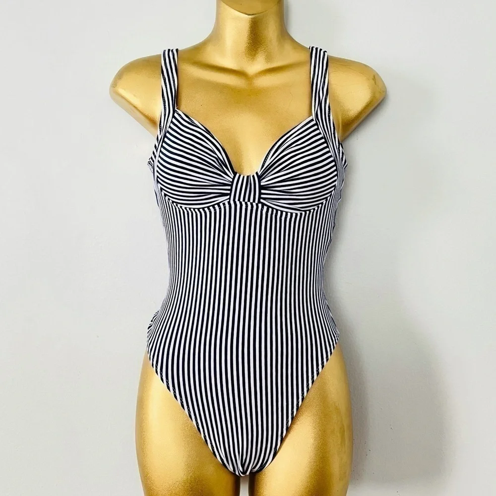 Sunsations vertical striped swimsuit euro summer 2025 coastal chic